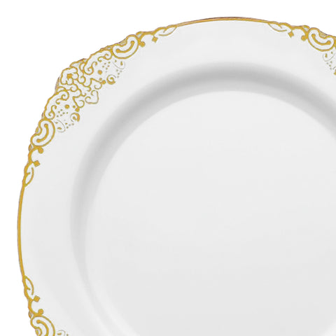 A plastic salad plate in white featuring an ornate gold decorative trim around the edge. The design includes intricate patterns and curls, creating an elegant and sophisticated look. The center of the plate is plain white, reminiscent of disposable plastic salad plates with a gold rim but more refined and BPA-free. This product is named 